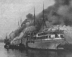 The RMS Empress of Scotland on fire at the scrapyard.